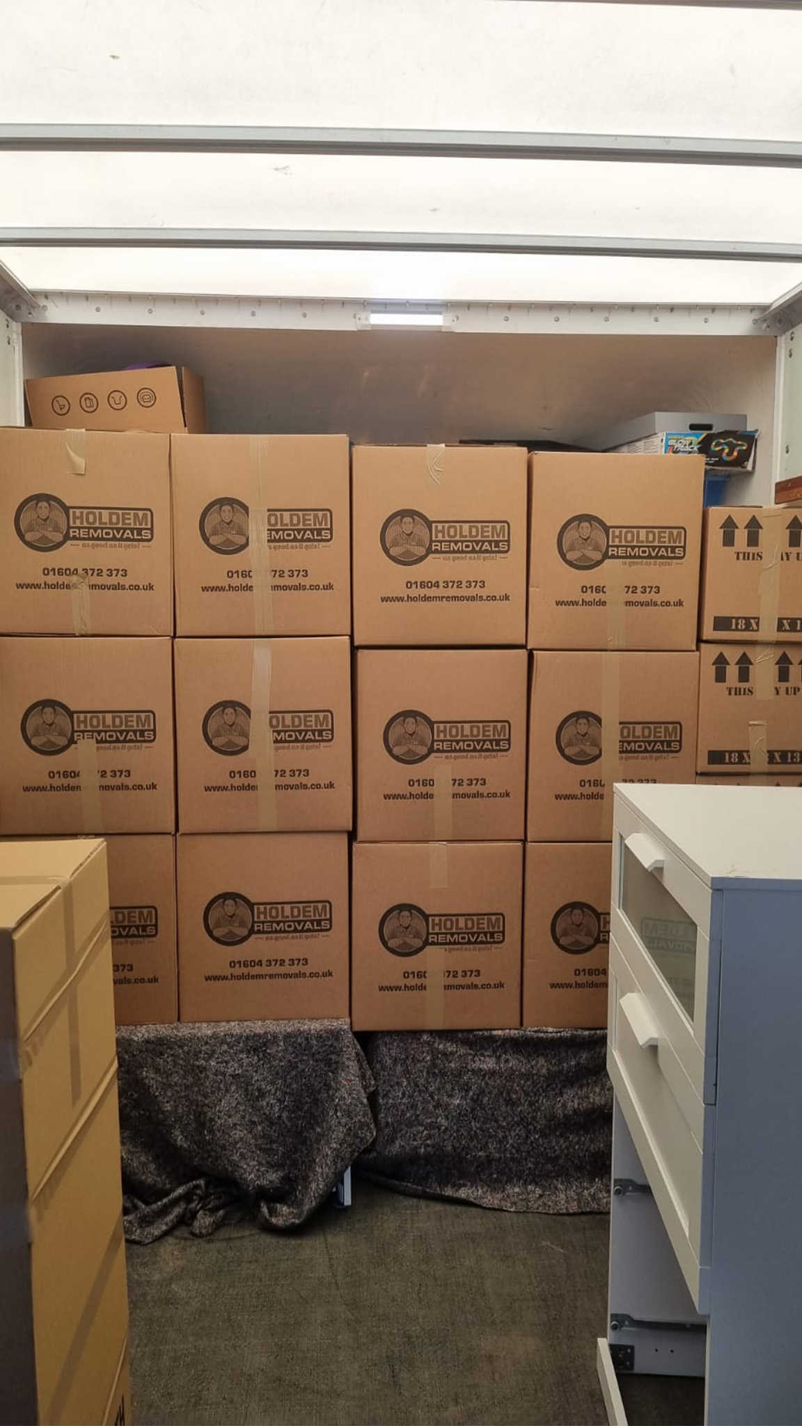 Team wrapping furniture