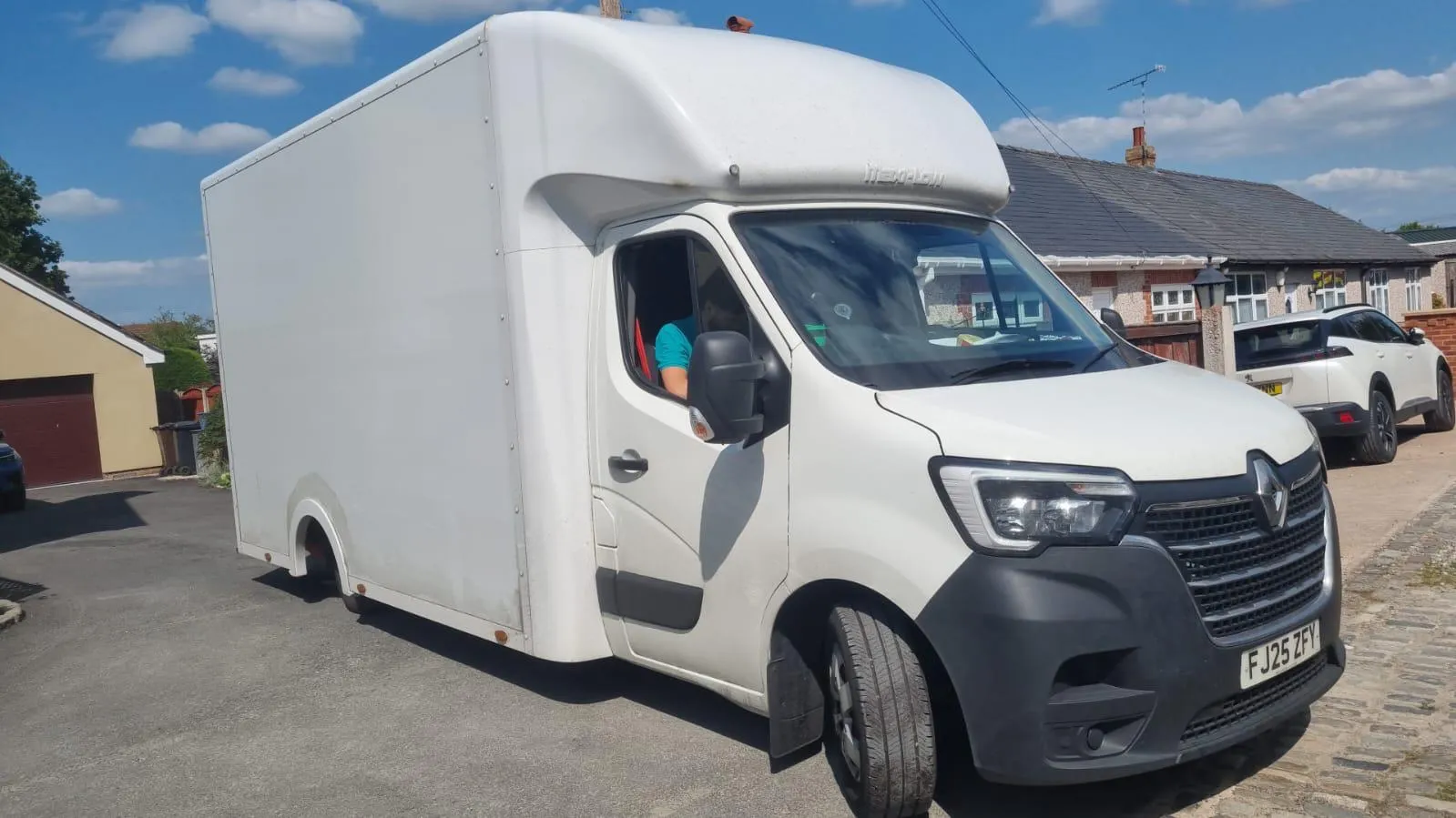Removal van outside a Wellingborough family home