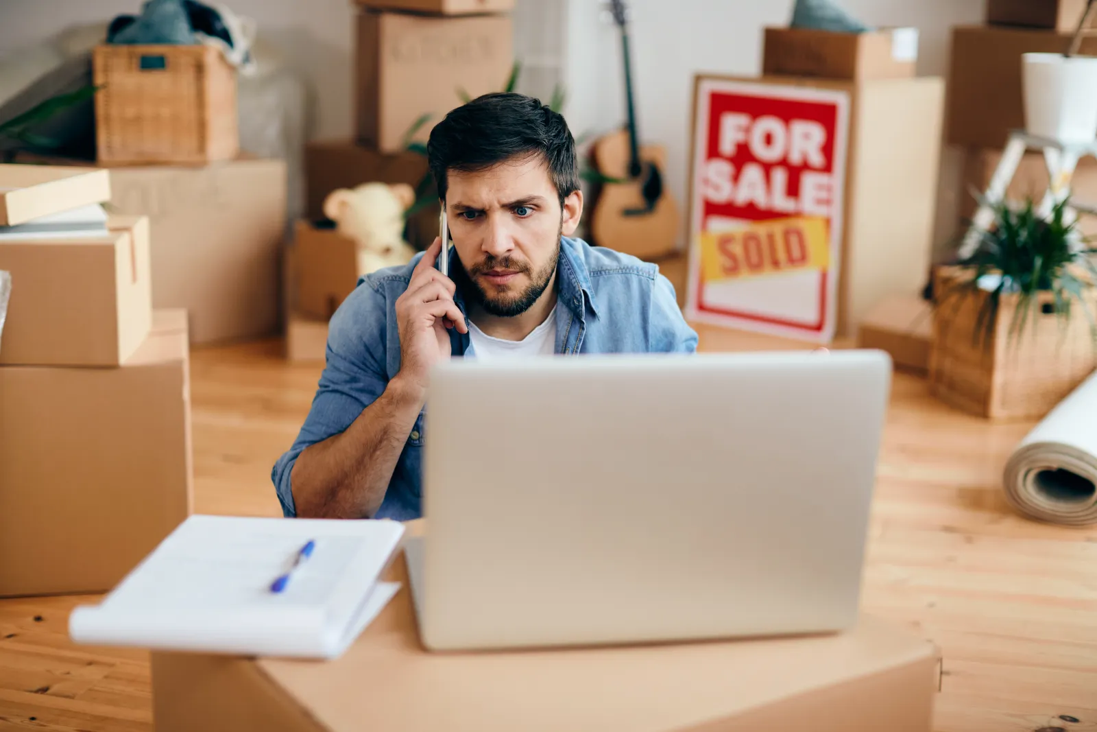 Person updating utility account online ahead of a house move